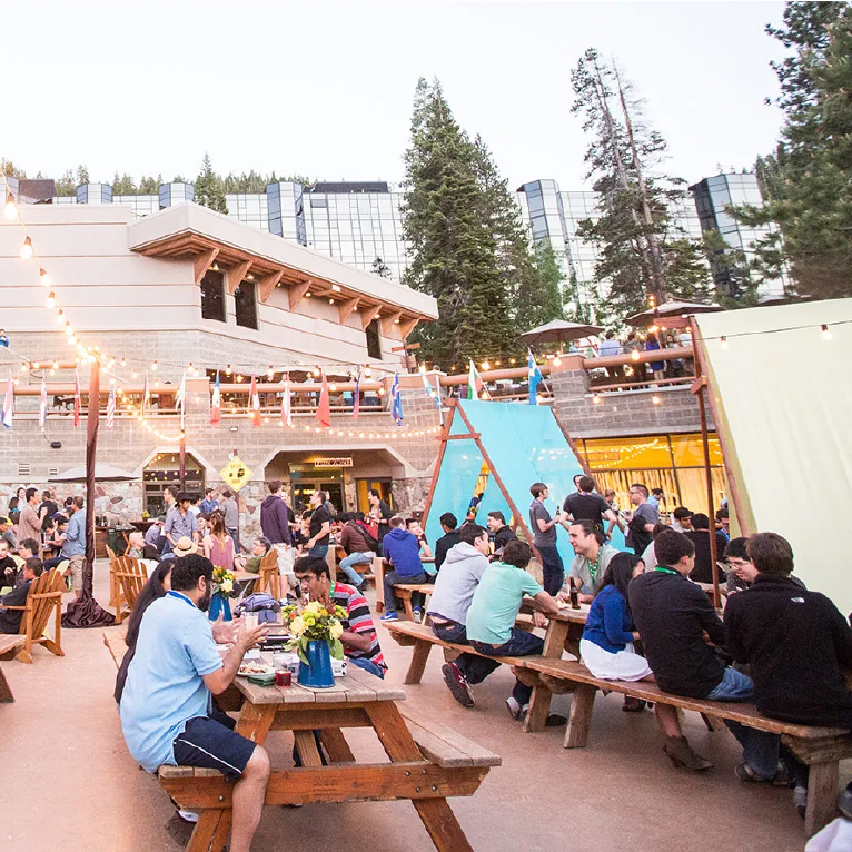 Camp Conference setting with woodsy decor and outdoor team-building elements