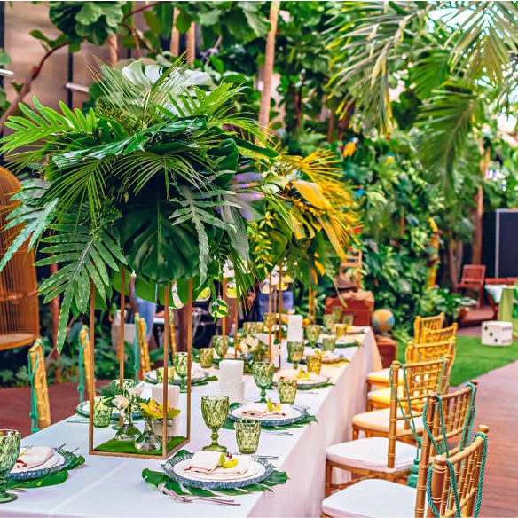 Tropical Think Tank theme with palm leaves and vibrant florals