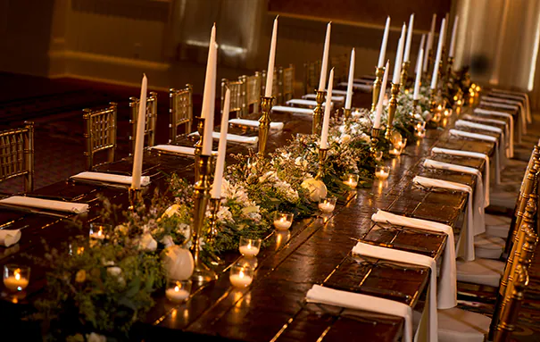 Tablescape featuring wood, branches, pumpkins, and gourds