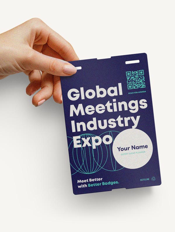 Stack of pre-printed personalized event badges ready for distribution