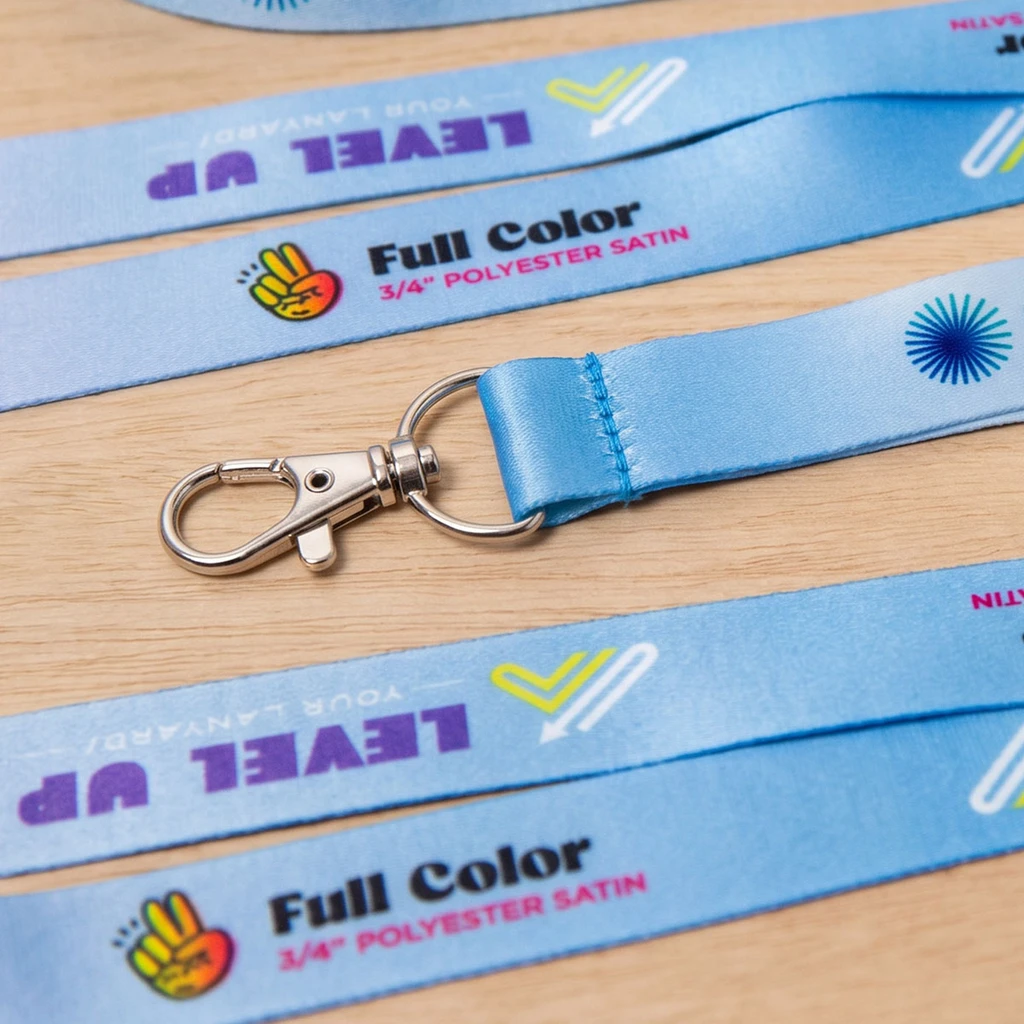 Close-up of a lanyard lobster clasp attached to a printed event badge